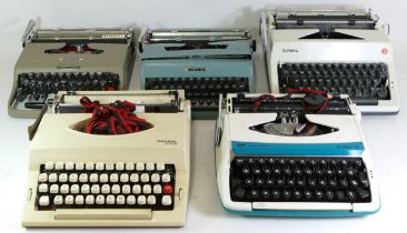 A collection of mid 20th century type writers.