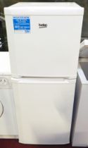 A Beko freestanding fridge/freezer, H136, W54, D54.