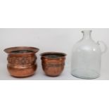 Two copper urns, together with a large glass measuring jug. (2)