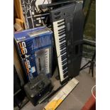 A Technics electronic keyboard with stand, model KN500, together with a Yamaha keyboard, PSS-795,