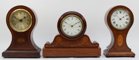 Three Edwardian inlaid mahogany mantel clocks.