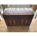 A late 19th Century brass and wood bound trunk / steamer chest having domed lid with detailed