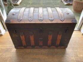 A late 19th Century brass and wood bound trunk / steamer chest having domed lid with detailed