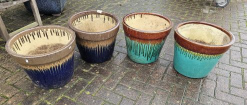 A pair of treacle glaze and dark blue pottery planters, diameter 44cm and a matching turquoise pair