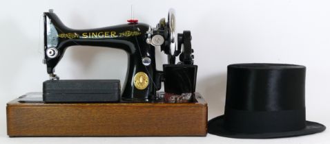 A cased Singer sewing machine and a cased Henry Heath top hat.