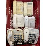 A collection of telephones with a postal scale