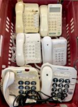 A collection of telephones with a postal scale