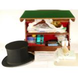 A large collection of magician tricks and equipment to include a toy rabbit.