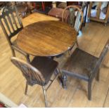 An Edwardian oak tilt top side table with four dining chairs together with a display cabinet (6)