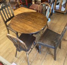 An Edwardian oak tilt top side table with four dining chairs together with a display cabinet (6)