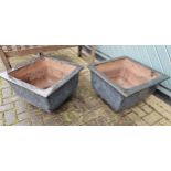 A pair of square blue glazed pottery planters, 55cm