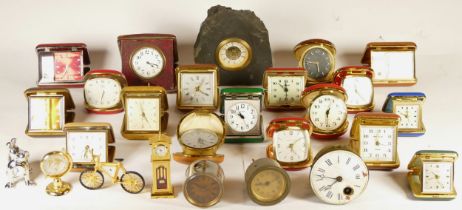 A collection of miniature novelty clocks, together with a quantity of traveling alarm clocks, having