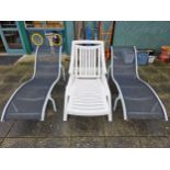 A pair of metal and fabric sun loungers and a plastic adjustable lounger