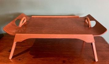 A mid 20th century teak and ply tea tray 'The Centurion' having fold out supports with makers