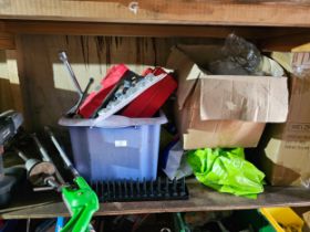 A shelf of garage tools