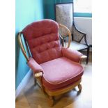 An Edwardian mahogany high back lounge chair, together with a later armchair. (2)