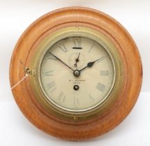 An early 20th century ships brass bulkhead clock, made by Smiths 'Astral' retailed by M.I Limited of