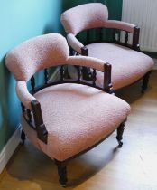 A pair of Edwardian mahogany tub chairs, newly upholstered in a pale pink pattern chenille fabric,