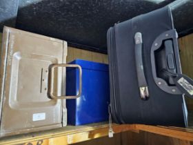 A W.D. ammo box, a metal tin and a set of three graduated suitcases.