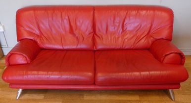 A modern red leather three seater sofa, L-186, H77 cm.