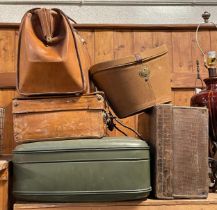 early 20th century leather suitcases together with a leather satchel and hat box