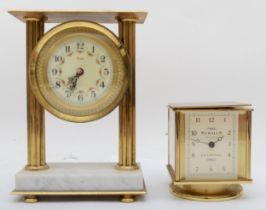 A brass cased rotating combination clock, 11 cm, together with another brass and marble based clock.