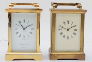 A Garrard & Co brass cased 8 day carriage clock, 12cm, together with another 8 day clock.