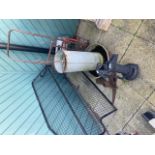 A cast iron garden water pump with a metal car dog guard, a galvanised feeder and other items