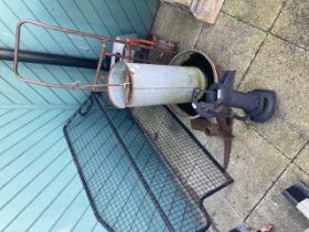 A cast iron garden water pump with a metal car dog guard, a galvanised feeder and other items
