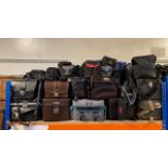 A substantial collection of camera cases, camera bags and lense cases, of various sizes and makers