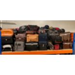 A substantial collection of camera cases, camera bags and lense cases, of various sizes and makers.
