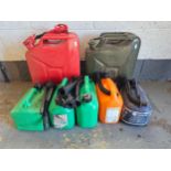 Two 20lt Jerry cans, and five plastic 1 gallon cans and A Singer electric sewing machine, model