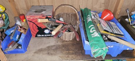 A shelf of tools, many unused.