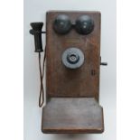 An early 20th century wall mounted telephone by Western Electric U.S.A, mahogany cased.