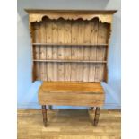A stripped pine drop leaf country table, 76 x 107 x 57cm, together with a pine dresser top.