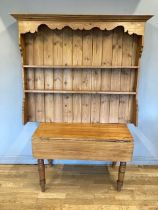 A stripped pine drop leaf country table, 76 x 107 x 57cm, together with a pine dresser top.