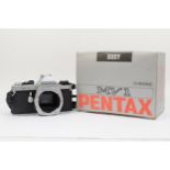 A Pentax MV-1 35mm film camera, body only, in original box, working, together with a Minolta MD 28mm