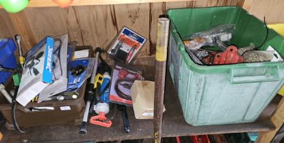 A shelf of tools, many unused.