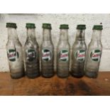 A set of six Castrol glass one pint bottles, all with caps