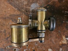 An A.M.A.C brass era carburetor.