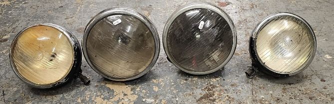 Two Lucus King of the Road headlamps, 8 inch glass, together with another pair, 7.5 inch glass.