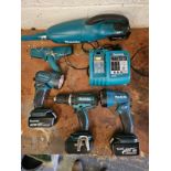 A Makita DC18RA charger, drill BHP452, two torches and a vacuum cleaner