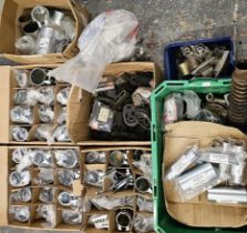 A large quantity of exhaust pipe brackets.