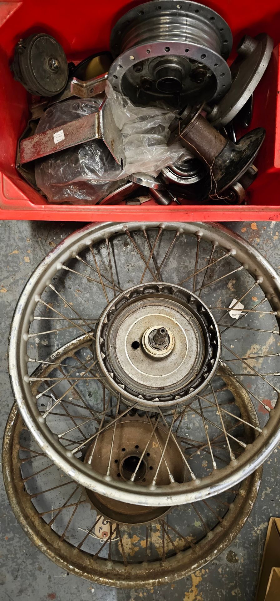 Two motorcycle wheels, two hubs and other parts.