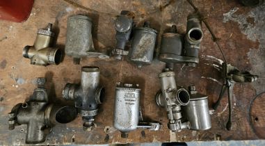 A collection of vintage carburetor bodys.