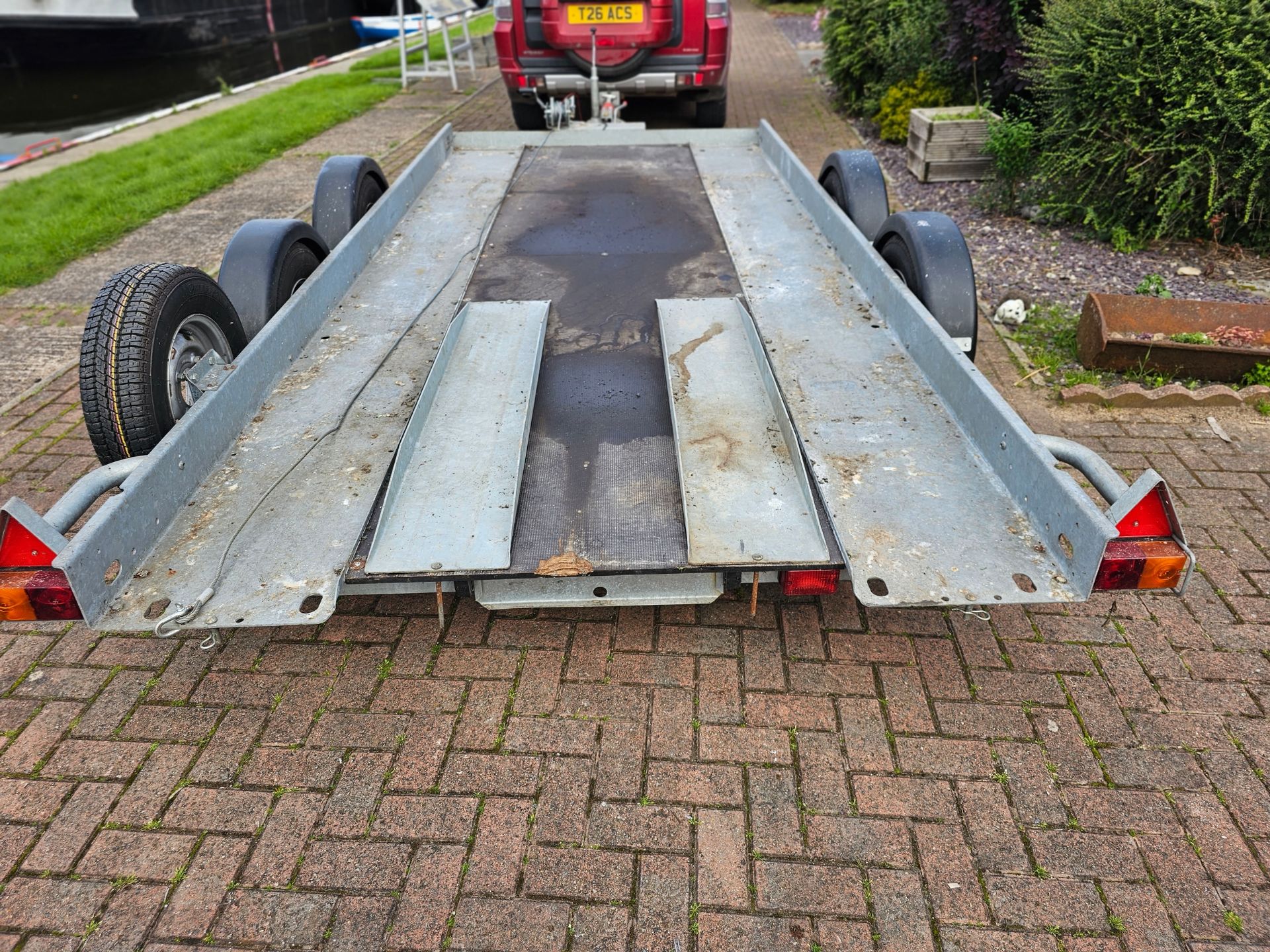 A Brian James, twin axle car trailer, up to 2700KG, with two ramps, manual winch and spare wheel. - Image 3 of 7