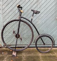 An early 20th century black enamelled Penny Farthing, front wheel 33" & back wheel 19" diameter,