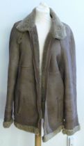 A brown sheepskin and fur lined gentlemens jacket, size large (faded)