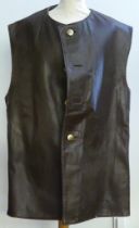 A World War II brown leather Jerkin style vest with brass buttons.