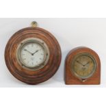 An early 20th century Smiths of London oak cased dome topped car dashboard clock, the dial with